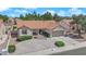 Aerial view showcasing a beautiful home with a tile roof, landscaped yard, and cozy front porch at 3000 Morning Ridge Dr, Las Vegas, NV 89134