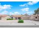Charming single-story home features a well-maintained front yard with desert landscaping and an attached two-car garage at 3000 Morning Ridge Dr, Las Vegas, NV 89134