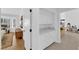 Hallway with built-in cabinets and counter space, connecting the bedrooms to the living spaces, plus hardwood floors at 3000 Morning Ridge Dr, Las Vegas, NV 89134