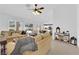 Bright living room featuring neutral decor, tile flooring, ceiling fan, and large windows offering plentiful natural light at 3000 Morning Ridge Dr, Las Vegas, NV 89134