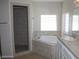 Bathroom featuring tub, shower and vanity with granite countertop at 3020 Peggy Ave, Pahrump, NV 89048