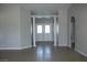 View of the bright entryway, showcasing tile floors, white columns, and a double-door front entry at 3020 Peggy Ave, Pahrump, NV 89048