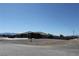 Long shot of the home showing its placement on a large lot, with space for RV parking at 3020 Peggy Ave, Pahrump, NV 89048
