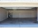 Spacious garage with concrete floors, lighting and water heater at 3020 Peggy Ave, Pahrump, NV 89048