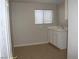 Laundry room featuring tile floors and utility sink at 3020 Peggy Ave, Pahrump, NV 89048