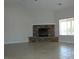 Large living room features a stone fireplace and big window for ample natural light at 3020 Peggy Ave, Pahrump, NV 89048