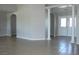 Open living area showing the layout, tile flooring, and entrance to a room with white columns at 3020 Peggy Ave, Pahrump, NV 89048