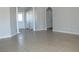 Spacious living area featuring tile floors and neutral paint, offering a blank canvas for new owners at 3020 Peggy Ave, Pahrump, NV 89048