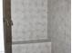 Close up of tiled shower with built-in seat and hand-held shower head at 3020 Peggy Ave, Pahrump, NV 89048