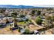 Expansive lot with lush greenery, featuring a charming home with solar panels, complemented by mountain views at 3100 Garehime St, Las Vegas, NV 89108