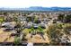 Expansive aerial view of a charming residence with a spacious backyard, mature trees, and potential for customization at 3100 Garehime St, Las Vegas, NV 89108