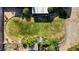 Aerial view of a backyard featuring lush lawn, mature trees and a charming gazebo at 3100 Garehime St, Las Vegas, NV 89108