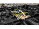 Scenic aerial view highlighting the property's expansive yard, lush greenery, home with solar panels, set in a tranquil neighborhood at 3100 Garehime St, Las Vegas, NV 89108
