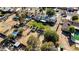 Wide aerial view of the single-Gathering home, showing a mature landscaped lawn and solar panels on the roof at 3100 Garehime St, Las Vegas, NV 89108