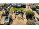 Beautiful aerial view showcasing an extra large yard, with a greenhouse, a shed and other outbuildings, and lush greenery at 3100 Garehime St, Las Vegas, NV 89108