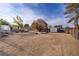 Spacious backyard with a storage shed and mature trees, offering a private outdoor space with room to customize at 3100 Garehime St, Las Vegas, NV 89108