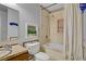 Bathroom featuring a combined tub and shower, tiled walls, and marble countertops at 3100 Garehime St, Las Vegas, NV 89108