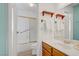 Clean bathroom with updated sink, vanity, and bathtub with sliding glass door at 3100 Garehime St, Las Vegas, NV 89108