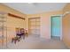 Bedroom featuring orange walls, carpet flooring, and a closet at 3100 Garehime St, Las Vegas, NV 89108