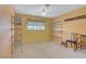 Bedroom featuring orange walls, carpet flooring, and metal shelving at 3100 Garehime St, Las Vegas, NV 89108