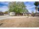 Charming single-story home with a well-maintained front yard, mature trees, and a long driveway leading to the garage at 3100 Garehime St, Las Vegas, NV 89108