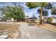 Charming single-story home with a well-maintained front yard, mature trees, and a long driveway leading to the garage at 3100 Garehime St, Las Vegas, NV 89108