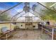 A greenhouse with shelving offers ample space for gardening and plant cultivation year-round at 3100 Garehime St, Las Vegas, NV 89108