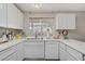 Well-lit kitchen showcasing a window above the sink and ample countertop space at 3100 Garehime St, Las Vegas, NV 89108