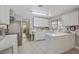Open kitchen with stainless steel appliances, and a view into the dining area at 3100 Garehime St, Las Vegas, NV 89108