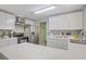 Bright kitchen featuring white cabinets, stainless steel appliances, and sleek countertops at 3100 Garehime St, Las Vegas, NV 89108