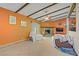 Inviting living room with beamed ceilings, fireplace, and outdoor access at 3100 Garehime St, Las Vegas, NV 89108