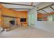 The living room features a stone fireplace, wooden beams, and tile flooring at 3100 Garehime St, Las Vegas, NV 89108