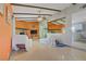 Open-concept living room with tile flooring, fireplace, and access to the kitchen at 3100 Garehime St, Las Vegas, NV 89108