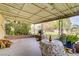 A comfortable covered patio leads to a large backyard with mature trees and plenty of room for recreation at 3100 Garehime St, Las Vegas, NV 89108