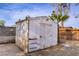 A storage shed provides a practical solution for storing tools and equipment in the backyard at 3100 Garehime St, Las Vegas, NV 89108