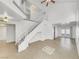 Bright entryway featuring a staircase and tile flooring that leads to the living area at 3444 Trilogy Dr, Las Vegas, NV 89108