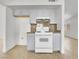 Kitchen with grey cabinets, granite countertops, and a white gas oven at 3444 Trilogy Dr, Las Vegas, NV 89108