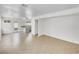 Living room with tile flooring, white walls, and doorway leading to kitchen and backyard at 3444 Trilogy Dr, Las Vegas, NV 89108