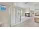 Primary bathroom featuring a glass-enclosed shower, soaking tub, and fireplace at 3755 Broadmead St, Las Vegas, NV 89147