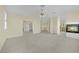 Expansive bedroom with neutral carpet, a modern fireplace, and multiple doorways leading to other rooms at 3755 Broadmead St, Las Vegas, NV 89147