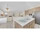 Bright and open kitchen with tiled island and stainless steel appliances at 3755 Broadmead St, Las Vegas, NV 89147