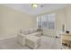 Neutral living room features a large window for natural light, comfortable seating and cozy carpeting at 3755 Broadmead St, Las Vegas, NV 89147