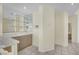 Stylish wet bar featuring mirrored backsplash and counter seating at 3755 Broadmead St, Las Vegas, NV 89147