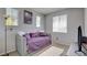 Comfortable bedroom with a gray color scheme, carpet, and natural light at 3840 Belle Glade St # 104, Las Vegas, NV 89129