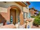 Charming two-story townhome featuring a front door with decorative spiral topiary and a cozy front patio at 3840 Belle Glade St # 104, Las Vegas, NV 89129