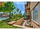 Enjoy the view from this lovely patio, with manicured landscaping, a glimpse of the pool, and comfortable seating at 3840 Belle Glade St # 104, Las Vegas, NV 89129