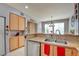 Bright kitchen features a breakfast bar with stainless steel appliances and modern fixtures at 3840 Belle Glade St # 104, Las Vegas, NV 89129