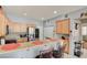 The kitchen features a breakfast bar with stainless steel appliances and ample storage at 3840 Belle Glade St # 104, Las Vegas, NV 89129