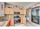 Well-lit kitchen boasts stainless steel appliances and ample countertop space at 3840 Belle Glade St # 104, Las Vegas, NV 89129