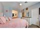 View of the bedroom leading to bathroom with a matching dresser and closet at 3840 Belle Glade St # 104, Las Vegas, NV 89129